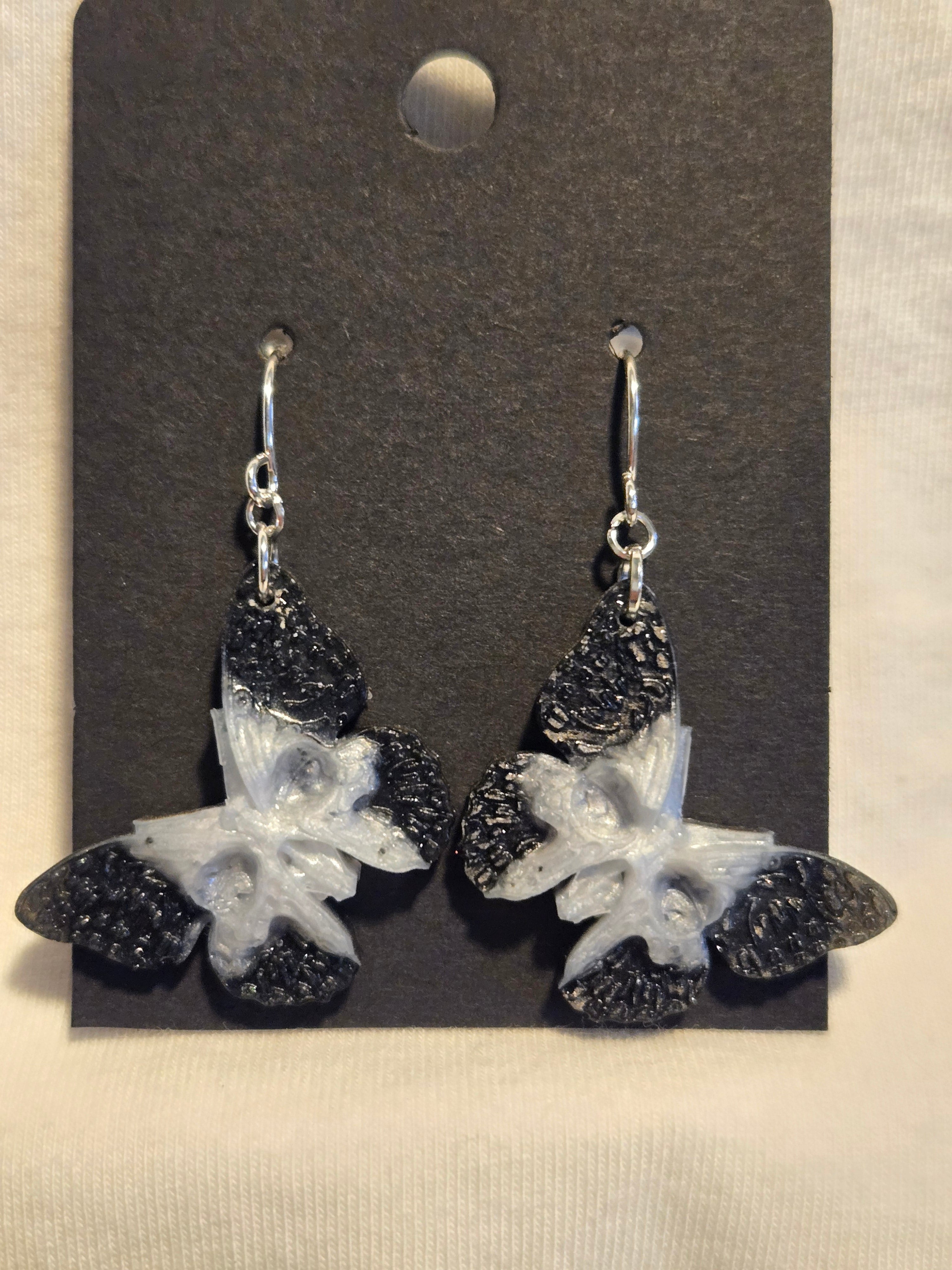 Skull moth dangle earrings