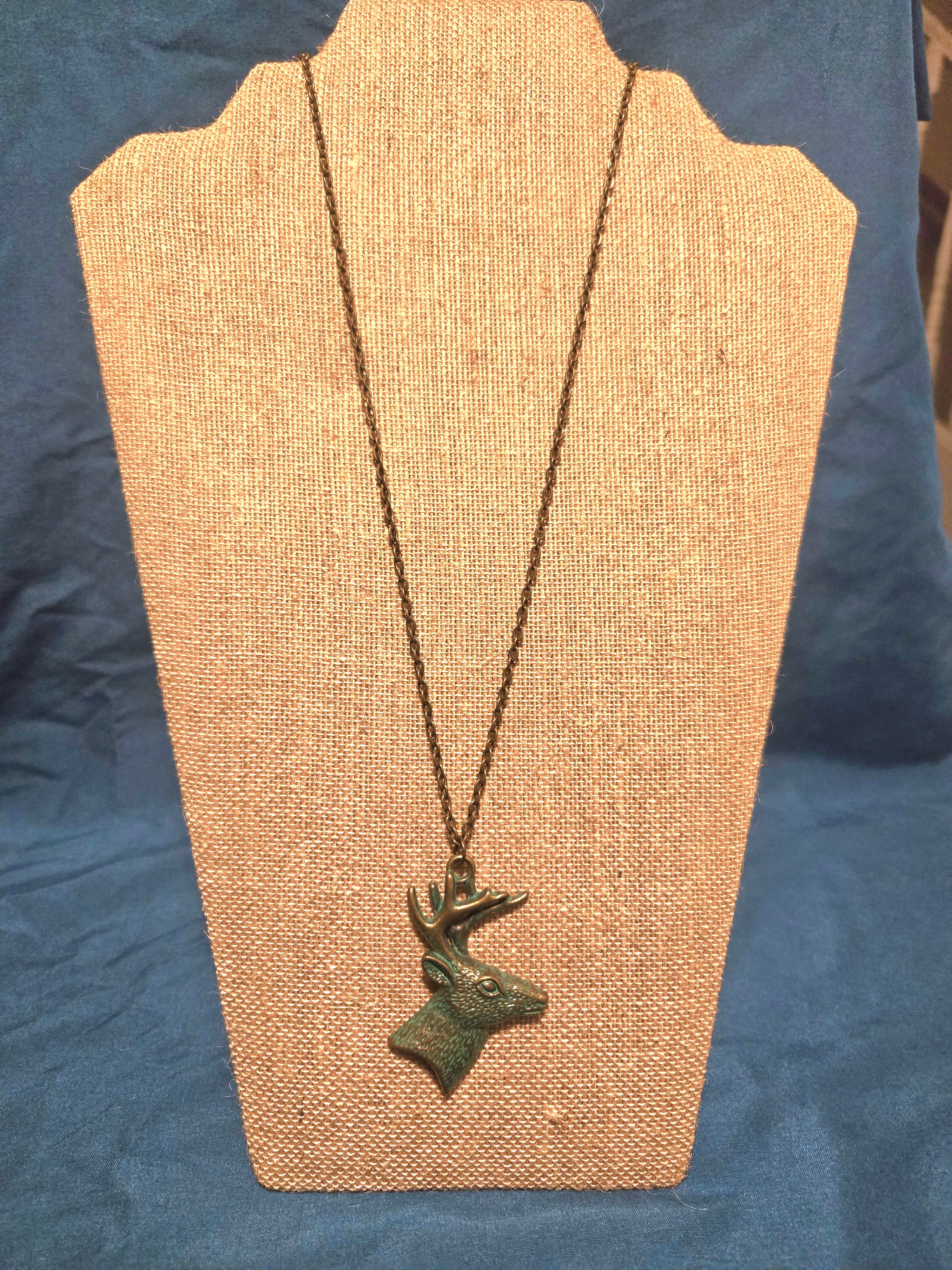 Deer necklace with patina finish