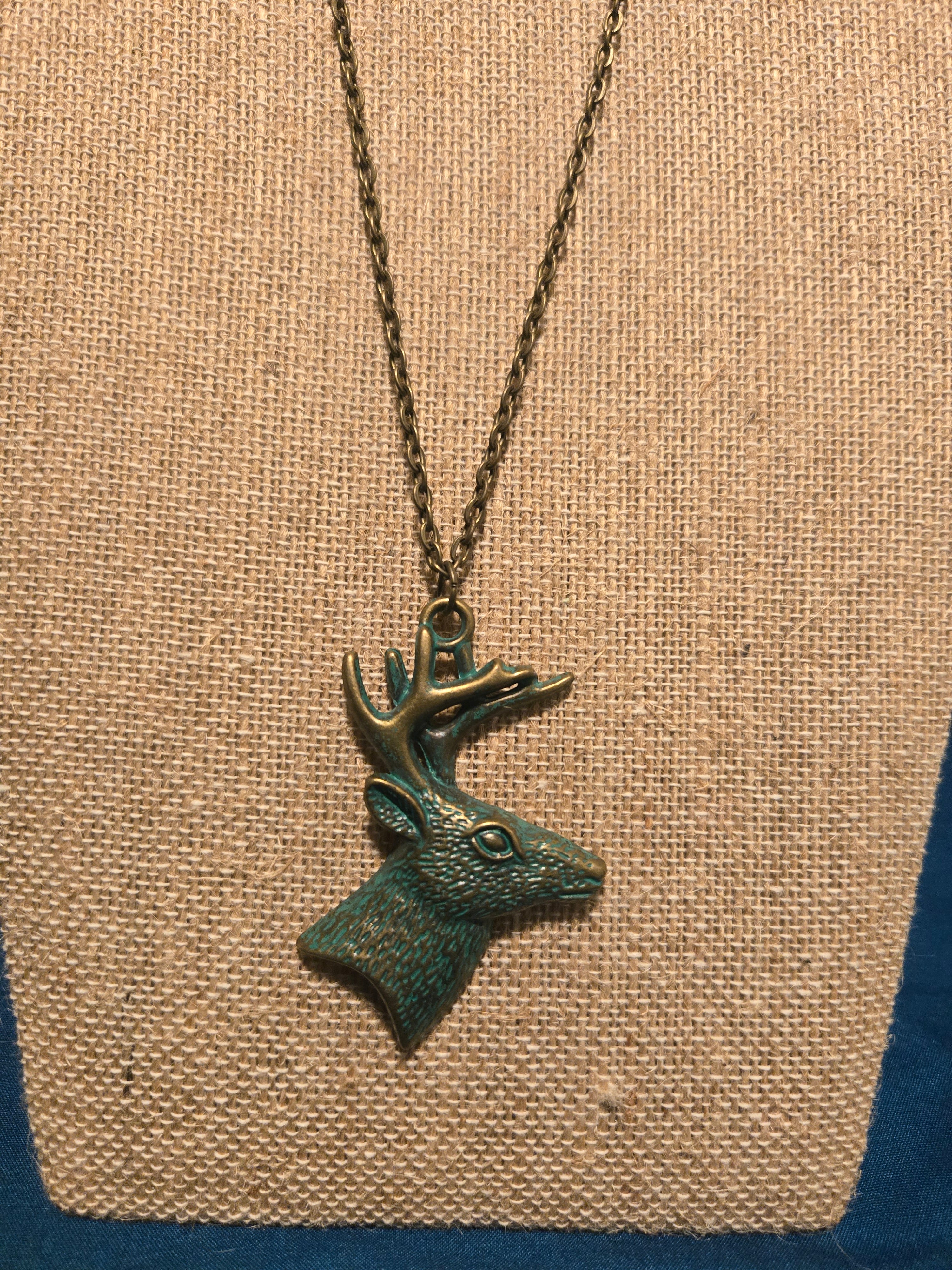 Deer necklace with patina finish